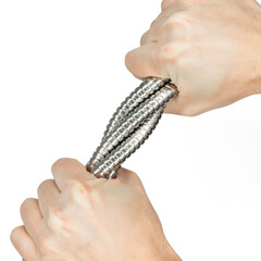 male hands holding and twisting shower hose
