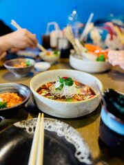 A variety of delicious Japanese food dishes on a table at a restaurant.