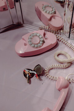 Pink vintage phone on dressing table