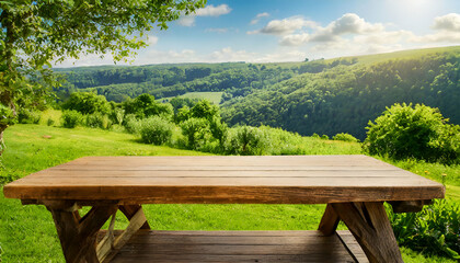 Fototapeta premium table in the mountains.A polished wooden desk with free space, positioned outdoors in a summer landscape with lush greenery and clear skies