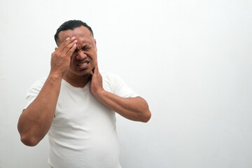 asian man feeling headache isolated on white background