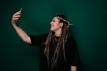 Woman With Dreadlocks Holding Cell Phone