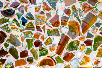 Mosaic background.  Close up. Wall mosaic with colorful broken ceramic plates.