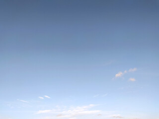 Fototapeta premium Clear blue sky texture and white fluffy cloud nature background. The sun shines bright in the daytime in summer