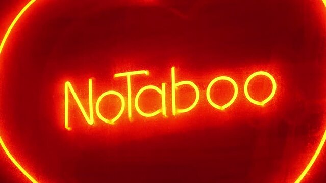 No Taboo red inscription at sex shop window. Peccability and moral degradation of society, decline in morals