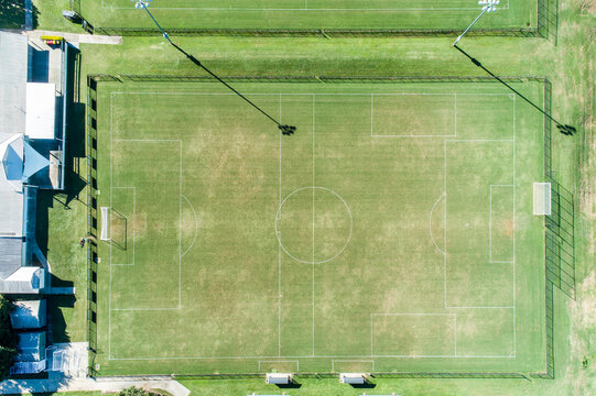 Fototapeta Aerial view of a grassy soccer football field.