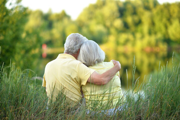 Loving mature couple in the park in summer