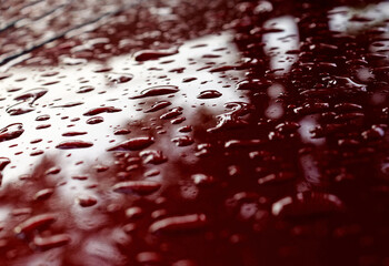 water drops on red surface