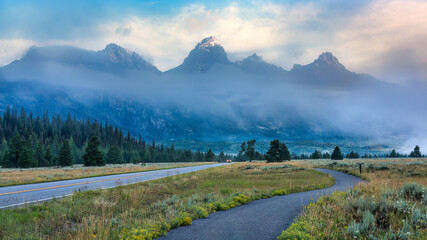 Fog and rising sun lighting the Grand Teton National Park - Windy Point turnout overlook