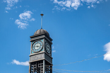 Beautiful city clock tower closeup on sunny summer day