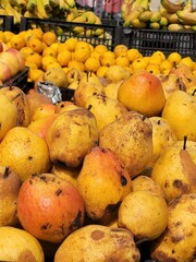 yellow ripe pears in the market close-up