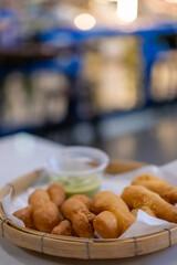 Pa Thong Ko, a popular Thai deep-fried dough or Thai-style Chinese cruller, served with Pandan Custard