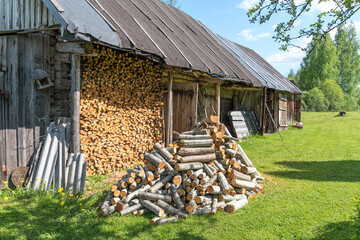 wood pile near an old barn