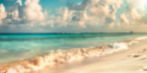 Obraz premium Tropical sandy beach with clear blue water and cloudy sky, ideal for travel and tropical paradise visuals.