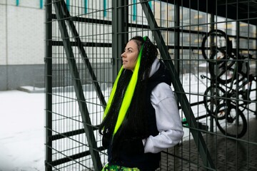 Woman Standing in Front of Metal Fence