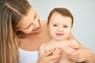 Bonding, portrait and mother holding baby at home for safety, love and protection. Happy, sweet and mom with cute toddler, kid or child for care and support together at family house in Australia.