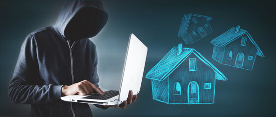 hacker  in suit using laptop with house icon