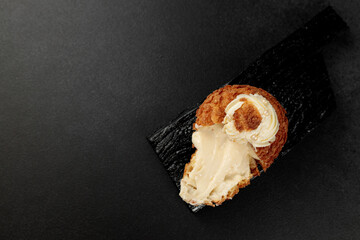 Classic Shu cake (choux). Custard dough based on butter and milk, classic custard filling with...