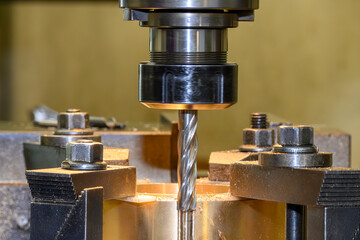 The plunge cutting  process on NC milling machine with brass material.