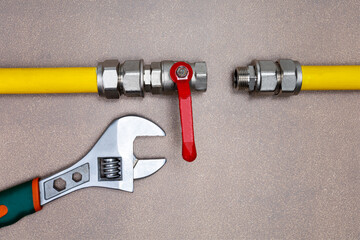 Gas tube with wrench. Concept of repairing gas pipeline.