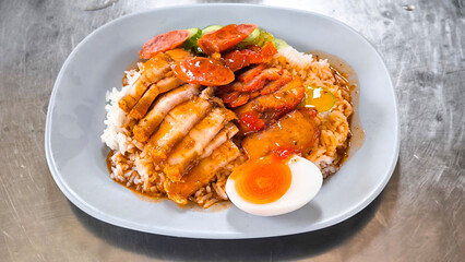 Crispy pork rice on a blue plate on the dining table
