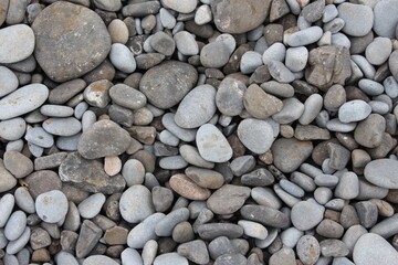 Background texture of pebbles on a beach.