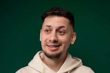 Smiling Man in White Hoodie