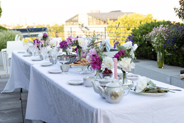 wedding table setting on a roof with a beautiful view of the city