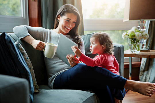 Happy woman, baby or mother in home with coffee to relax, chill and enjoy bonding on sofa in England. Mom, smile or parent on break for tea, cappuccino or caffeine in lounge with girl, child or kid