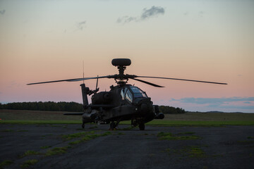 apache attack helicopter sunset stationary