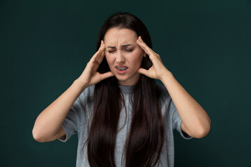 Woman Holding Her Head in Distress