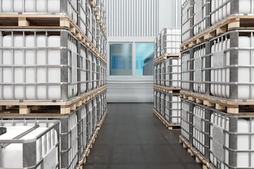 Tanks for storing chemicals. Warehouse with white barrels on pallets. Storage with tanks in metal frame. Chemical products warehouse inside hangar. Storehouse in industrial building. 3d image.