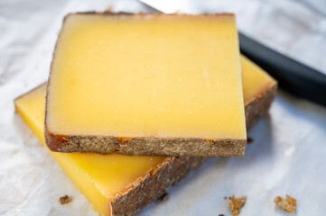 French cheese Comte, varieties unpasteurised ed milk Prestige, fruity flavoured Fruite and Vieille Reserve close up