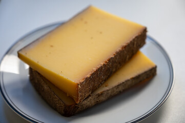 French cheese Comte, varieties unpasteurised ed milk Prestige, fruity flavoured Fruite and Vieille Reserve close up