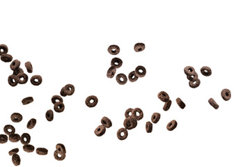Chocolate rings cereal spill out into a bowl. Breakfast.