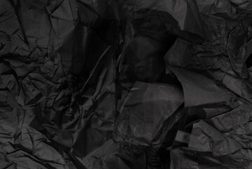 Abstract black paper texture background. Top view.