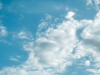 Fototapeta premium Sky and fluffy cloud scenery in the morning is incredibly calming to start the day,sky and fluffy white cloud made me feel relaxed,sky and fluffy cloud scenery take a majestic and breathtaking beauty