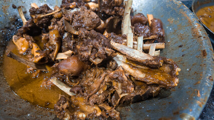 Balungan Tengkleng is traditional goat meat dish in a wok pan. Tongseng and Sate klathak from Imogiri, Yogyakarta