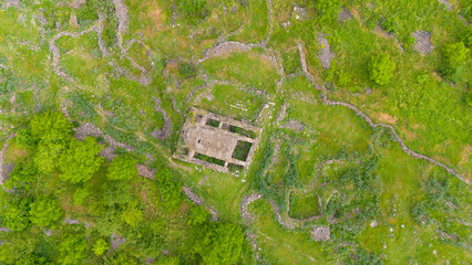 Ruins on the green glade view on top © Karen