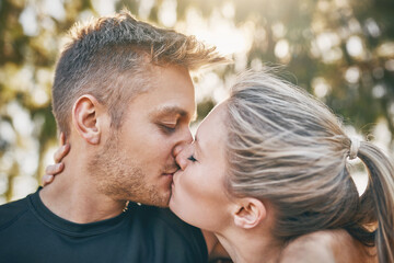 Happy couple, kiss and nature with love for embrace, care or support together at outdoor park. Closeup of man, woman or lovers with intimacy, affection or bonding for romance, date or anniversary