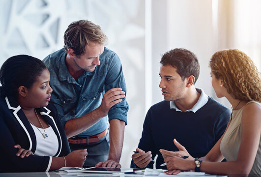 Business people, teamwork and cooperation with conversation, corporate and professional in modern office. Staff, employees and coworkers with ideas, collaboration and diversity with multicultural