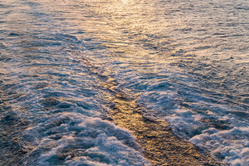 sea and waves caused by cruise ship