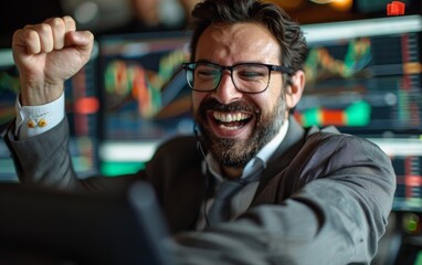 Fototapeta premium A man in a suit is smiling and holding his hands up in the air. He is wearing glasses and he is happy