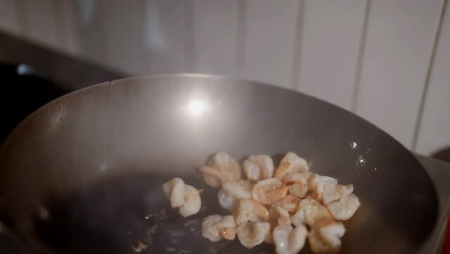 In the cafe, a close-up captures the refined Asian dishes and the cooking process: the skillful hands of the chef create culinary masterpieces filled with aromas and flavors of Asia.