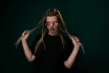 A Man With Long Dreadlocks and Red Glasses