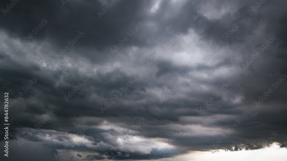 Aufkleber The dark sky with heavy clouds converging and a violent storm before the rain.Bad or moody weather sky and environment. carbon dioxide emissions, greenhouse effect, global warming, climate change