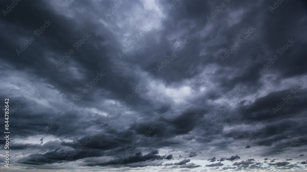 Aufkleber The dark sky with heavy clouds converging and a violent storm before the rain.Bad or moody weather sky and environment. carbon dioxide emissions, greenhouse effect, global warming, climate change