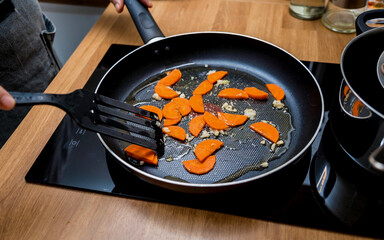 Chef at the kitchen preparing japanese buckwheat pasta with lentils