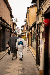 Fototapeta premium Japanese Kimono back view photography. Kyoto, Japan. Japanese traditional background.