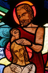 Fototapeta premium Stained glass representing the baptism of Christ. Vitrail représentant le bâptème du Christ. Annecy - France